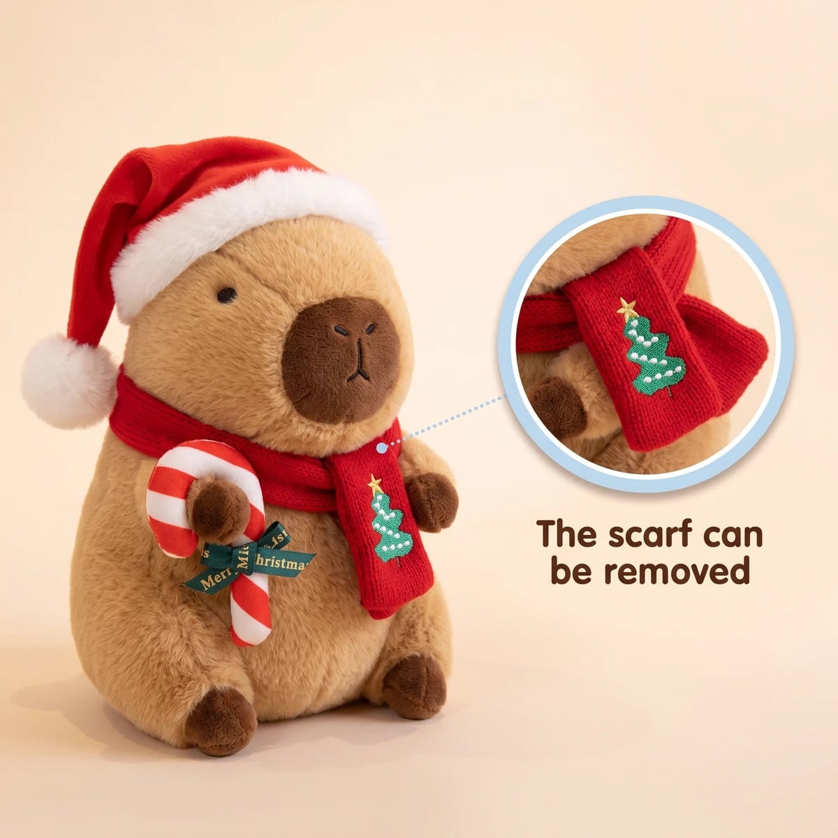 Christmas capybara plush with a Santa hat holding a candy cane with a close-up showing that the scarf can be removed