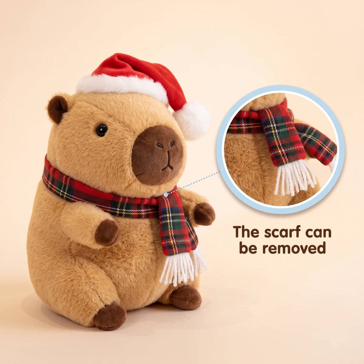 Christmas capybara plush with a Santa hat and a red tartan scarf with a close-up showing that the scarf can be removed