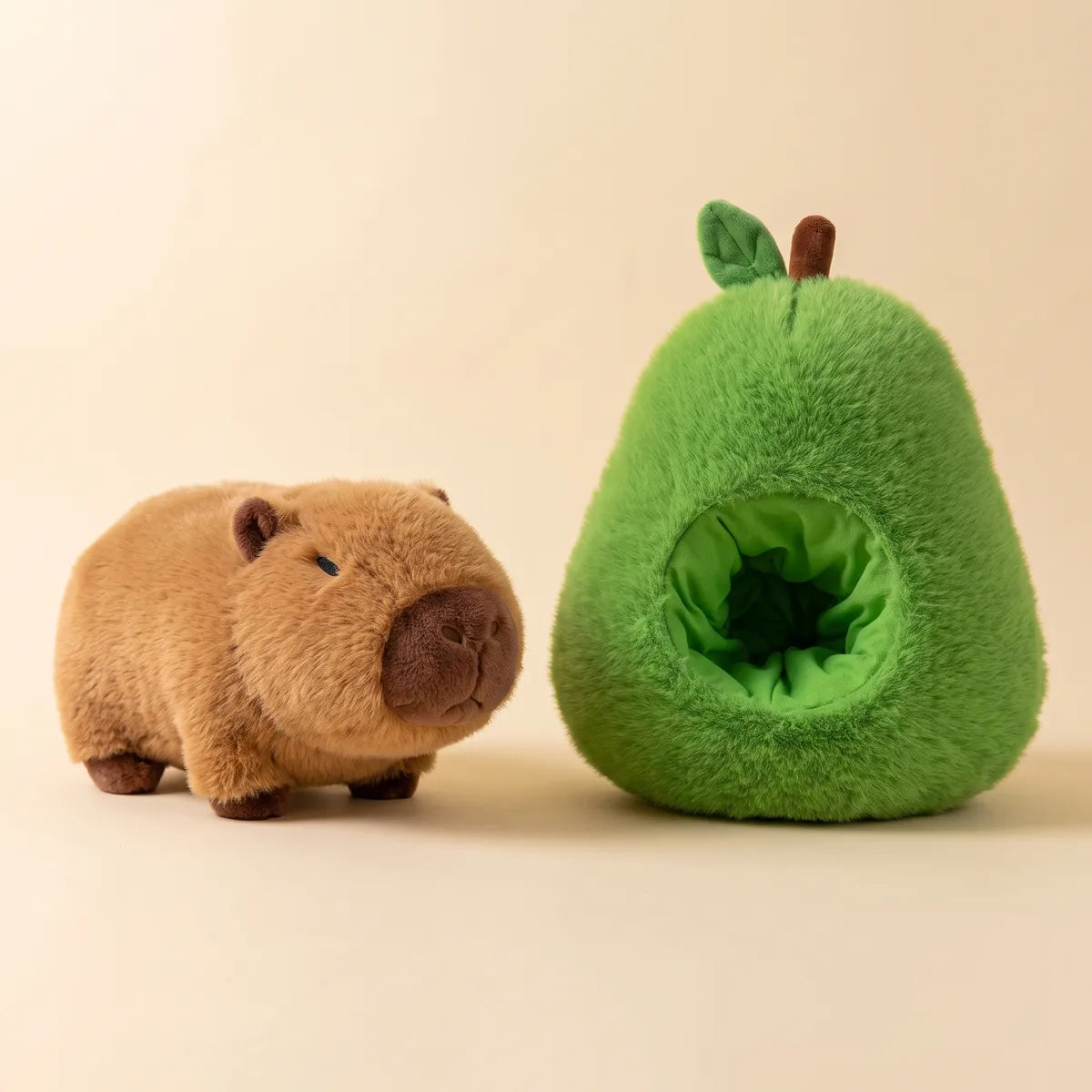 Avocado house capybara plush set with the capybara and its green avocado home side by side