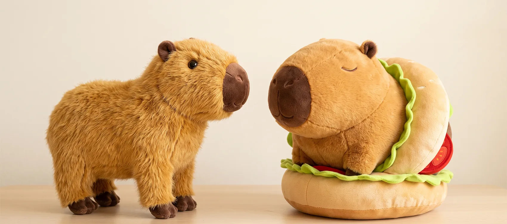 Realistic standing capybara plush next to a burger capybara plush, both standard size